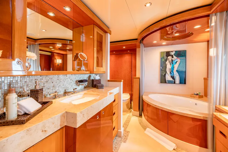 Impromptu Yacht Photos Pics Luxurious bathroom on 2011 Trinity Yachts CUSTOM with modern fixtures and elegant wood finishes.