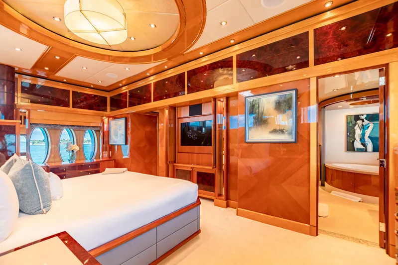 Impromptu Yacht Photos Pics Luxurious bedroom interior of 2011 Trinity Yachts CUSTOM model with elegant wood finishes and modern decor.