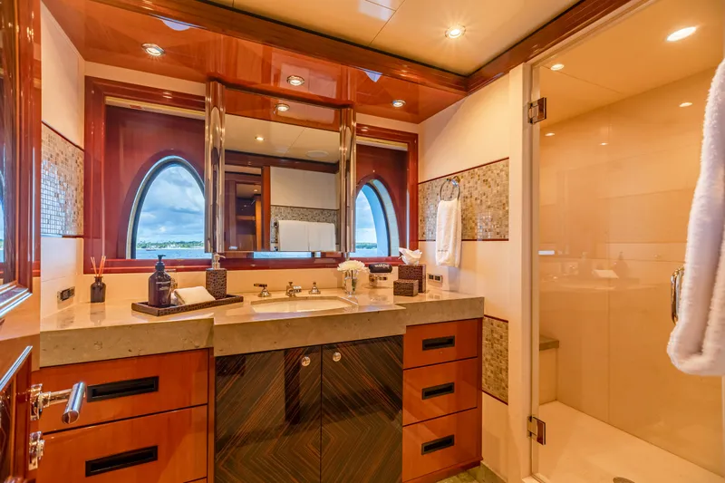 Impromptu Yacht Photos Pics Luxurious bathroom on 2011 Trinity Yachts CUSTOM with elegant wood finishes and modern fixtures.