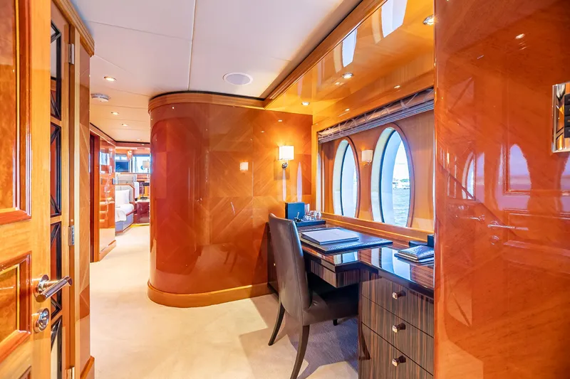 Impromptu Yacht Photos Pics Luxurious interior of 2011 Trinity Yachts CUSTOM with elegant wood finishes and a workspace.