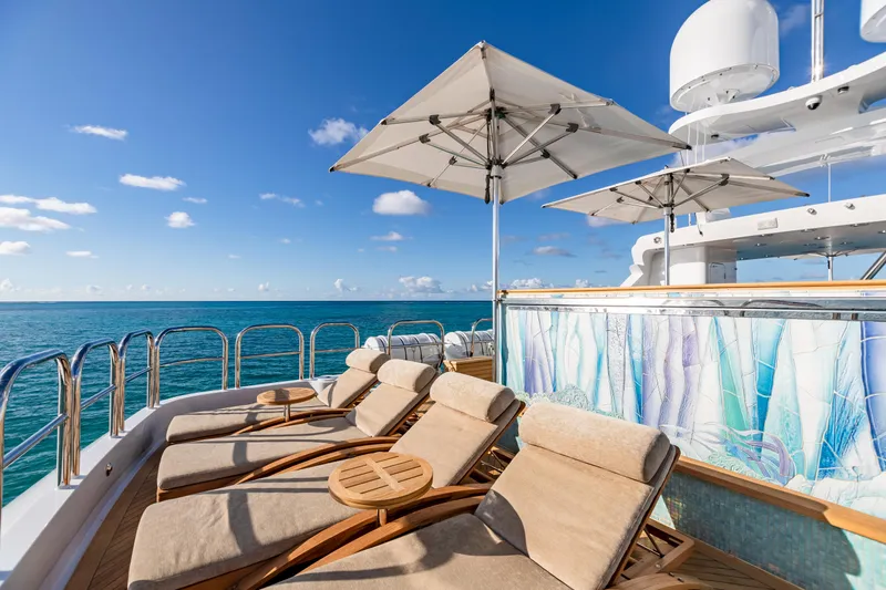Impromptu Yacht Photos Pics Luxury deck of 2011 Trinity Yachts CUSTOM with sun loungers and ocean view.