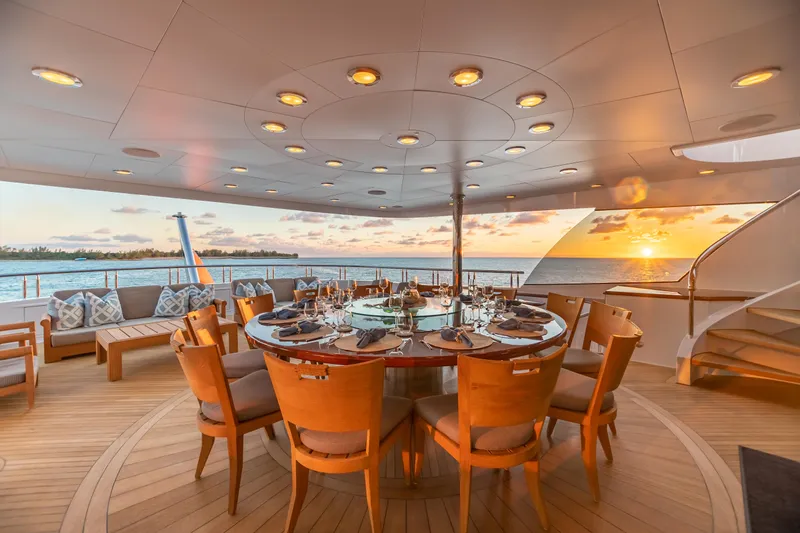 Impromptu Yacht Photos Pics Luxury dining area on 2011 Trinity Yachts CUSTOM at sunset.