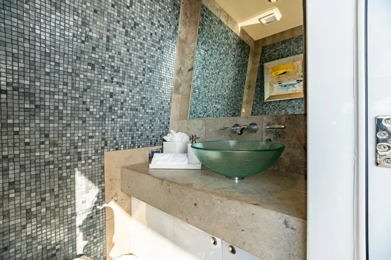 Impromptu Yacht Photos Pics Luxurious bathroom on 2011 Trinity Yachts CUSTOM with glass sink and mosaic tile wall.