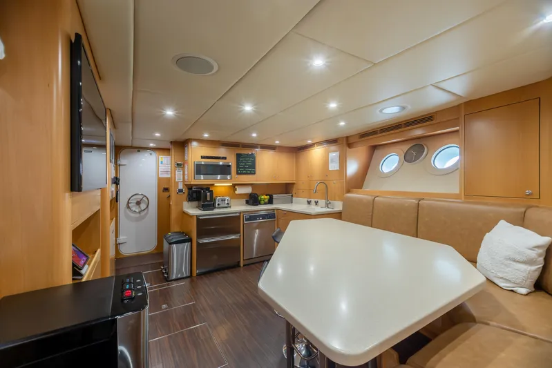 Impromptu Yacht Photos Pics Luxurious kitchen and dining area inside a 2011 Trinity Yachts CUSTOM yacht.