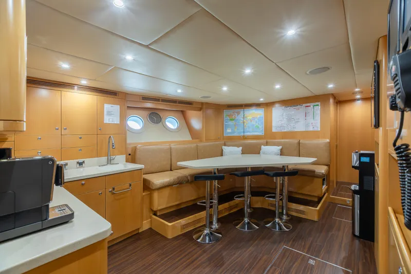 Impromptu Yacht Photos Pics Luxurious interior of 2011 Trinity Yachts CUSTOM model with modern seating and dining area.
