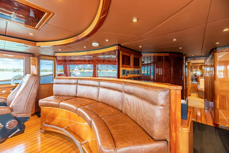 Impromptu Yacht Photos Pics Luxurious interior of 2011 Trinity Yachts CUSTOM with leather seating and wooden finishes.