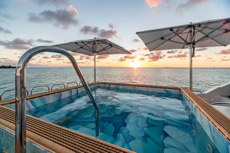 Impromptu Yacht Photos Pics Luxury yacht pool at sunset, Trinity Yachts CUSTOM 2011 model.