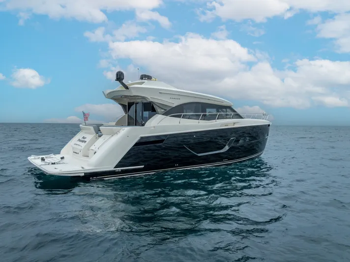 Pier Pressure Yacht Photos Pics 2017 Carver C52 Coupe yacht on open sea.