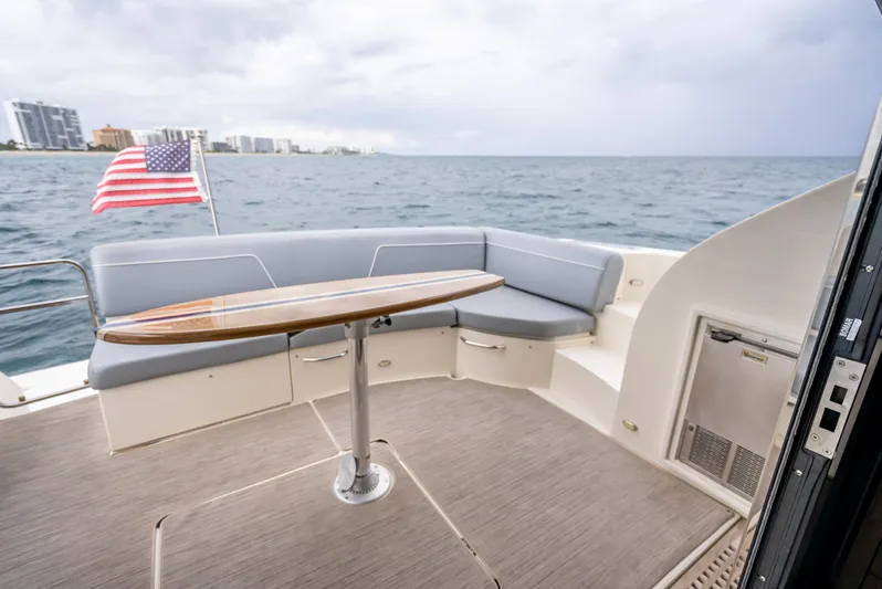 Pier Pressure Yacht Photos Pics Carver C52 Coupe 2017 with seating area and ocean view.