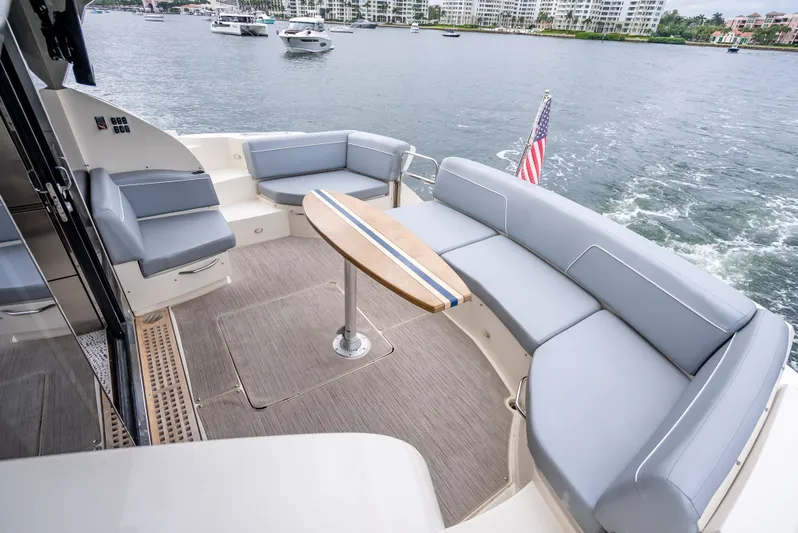 Pier Pressure Yacht Photos Pics 2017 Carver C52 Coupe yacht with elegant deck seating area.