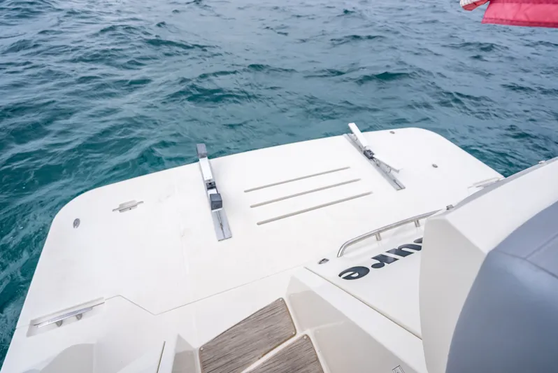 Pier Pressure Yacht Photos Pics Rear view of Carver C52 Coupe yacht on the water.