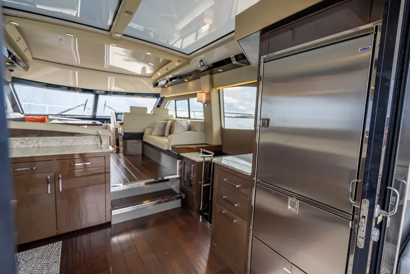 Pier Pressure Yacht Photos Pics Interior of 2017 Carver C52 Coupe yacht with modern kitchen.