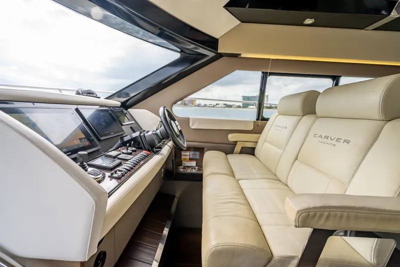 Pier Pressure Yacht Photos Pics Interior of 2017 Carver C52 Coupe with luxurious leather seating.