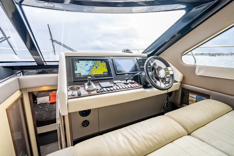 Pier Pressure Yacht Photos Pics Interior of 2017 Carver C52 Coupe with modern helm console.