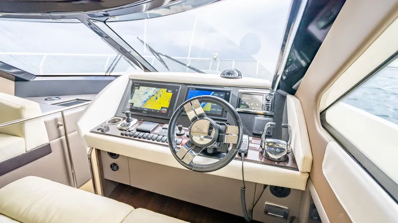Pier Pressure Yacht Photos Pics Interior of 2017 Carver C52 Coupe with modern helm console.