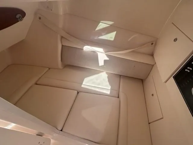  Yacht Photos Pics Interior cabin of 2019 Grady-White Freedom 325 boat with beige seating.