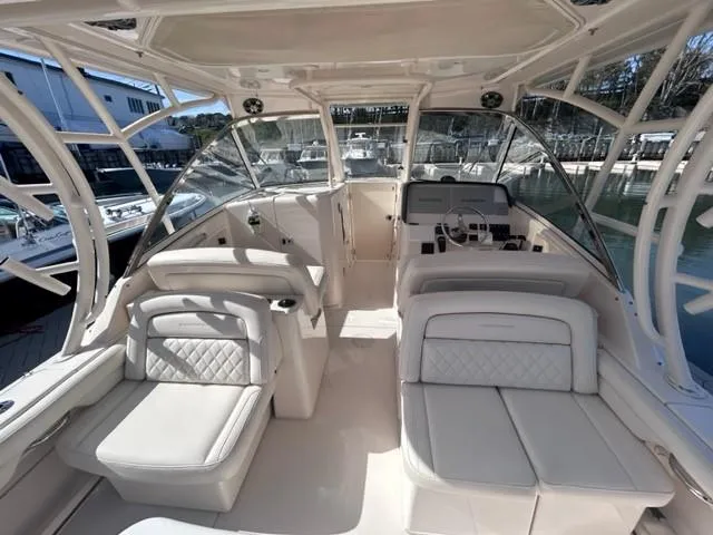  Yacht Photos Pics 2019 Grady-White Freedom 325 boat interior with luxurious seating and helm station.