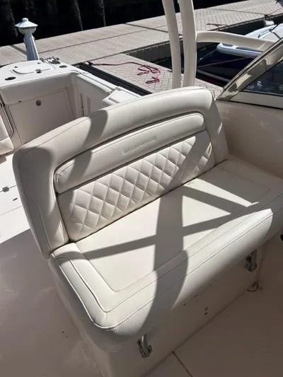  Yacht Photos Pics 2019 Grady-White Freedom 325 boat with white cushioned seating.