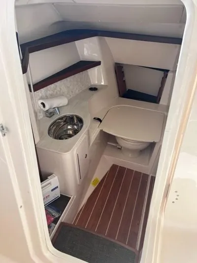 Yacht Photos Pics 2019 Grady-White Freedom 325 boat interior with sink and toilet.
