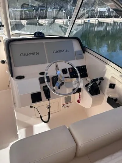  Yacht Photos Pics 2019 Grady-White Freedom 325 boat helm with Garmin navigation system.