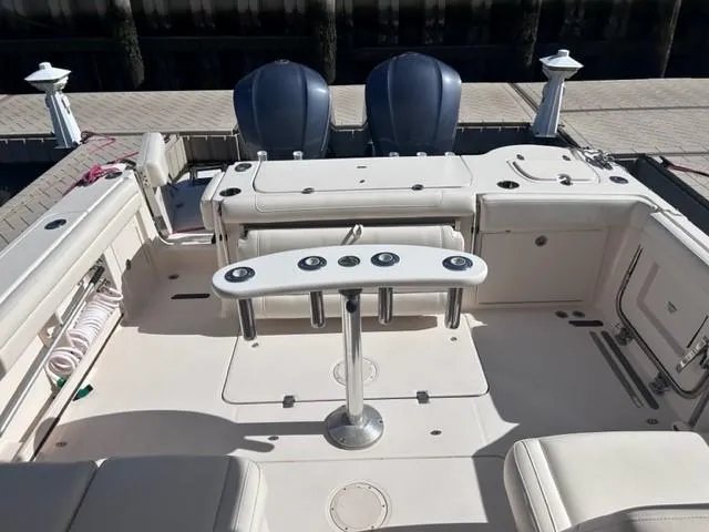  Yacht Photos Pics 2019 Grady-White Freedom 325 boat interior with dual outboard motors and fishing rod holders.