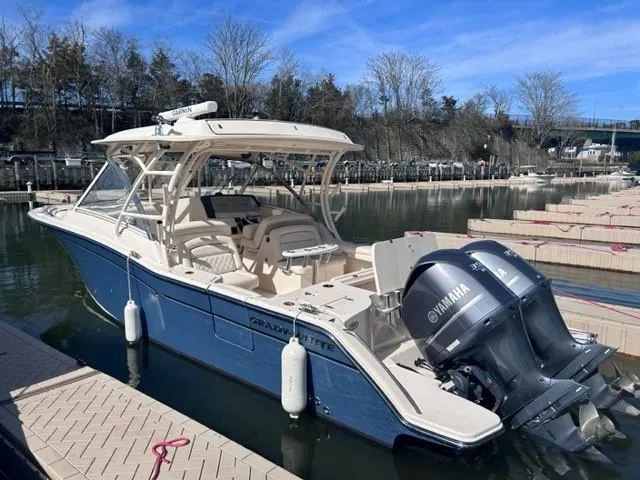  Yacht Photos Pics 2019 Grady-White Freedom 325 boat docked, featuring twin Yamaha outboard engines.