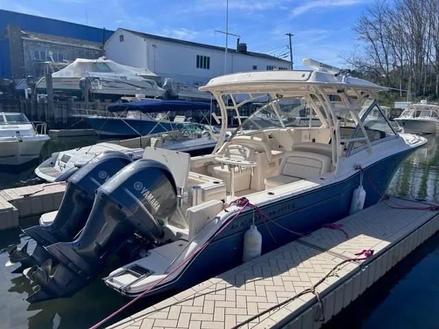  Yacht Photos Pics 2019 Grady-White Freedom 325 boat docked with twin Yamaha engines.