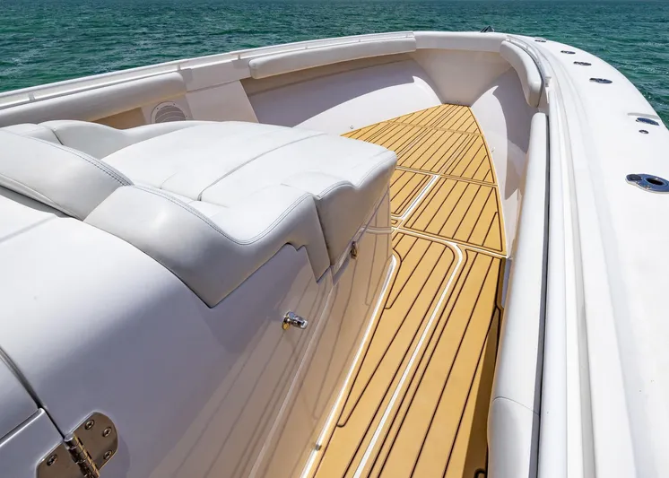  Yacht Photos Pics 2021 HCB 53 Sueños boat with teak deck and white seating on open water.