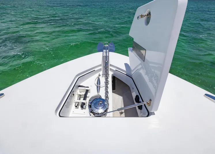  Yacht Photos Pics HCB 53 Sueños 2021 boat anchor compartment open on turquoise water.