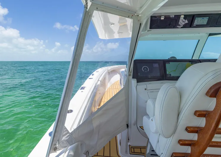  Yacht Photos Pics 2021 HCB 53 Sueños boat interior with ocean view and navigation screens.