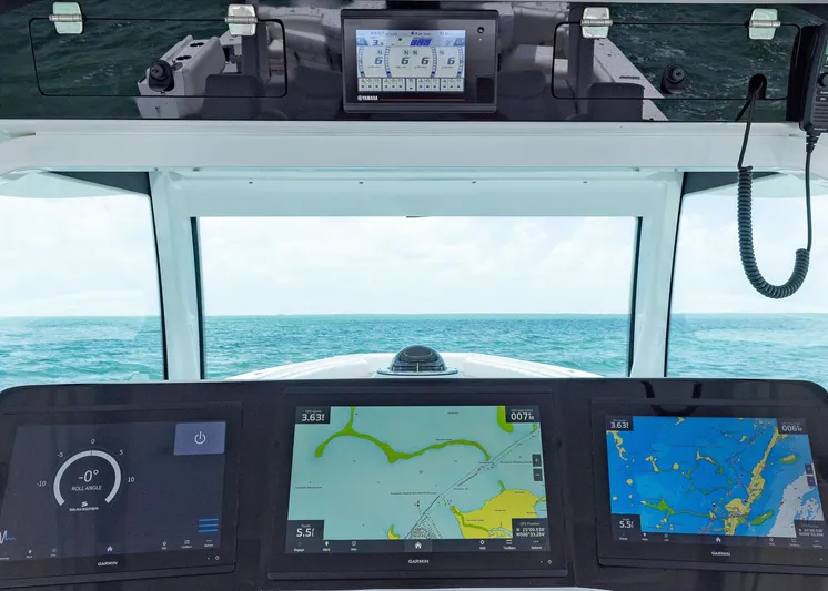  Yacht Photos Pics Cockpit view of 2021 HCB 53 Sueños with navigation screens and ocean horizon.
