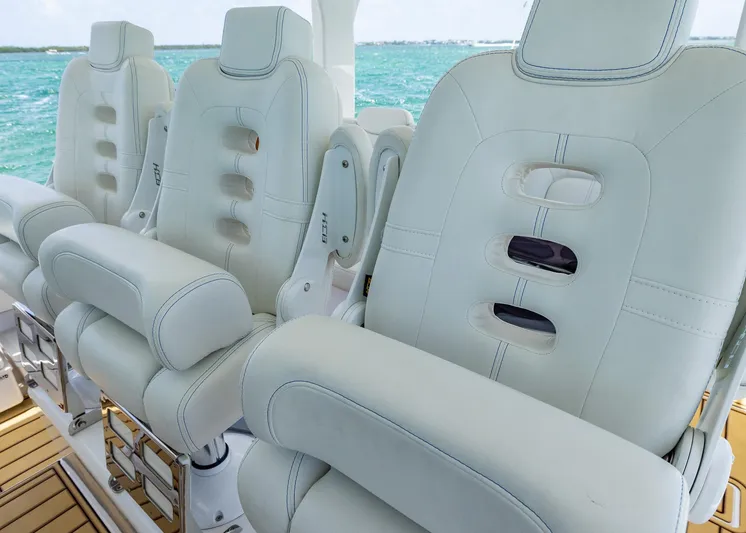  Yacht Photos Pics Luxury seating on 2021 HCB 53 Sueños boat with ocean backdrop.