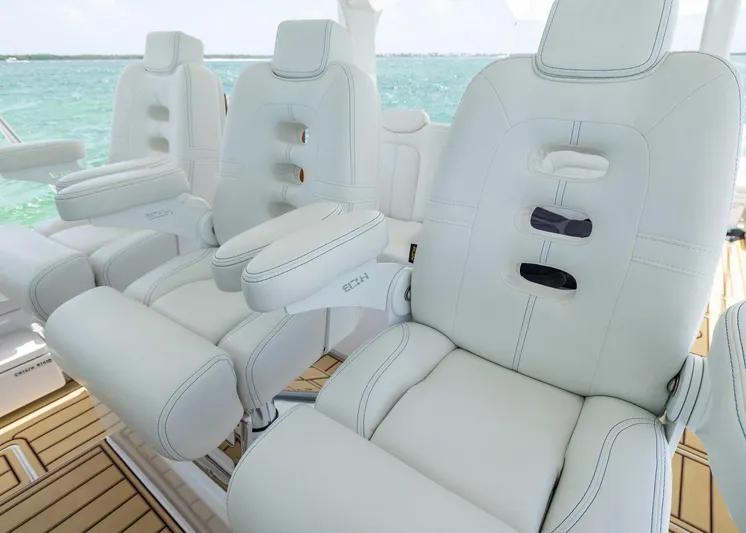  Yacht Photos Pics Luxurious white seating on 2021 HCB 53 Sueños boat, overlooking turquoise ocean waters.