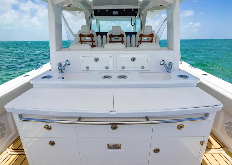  Yacht Photos Pics Luxury HCB 53 Sueños yacht interior with sleek white cabinetry and ocean view, 2021 model.