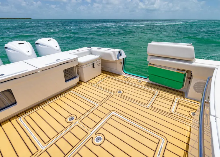  Yacht Photos Pics HCB 53 Sueños 2021 boat deck with teak flooring, ocean view.