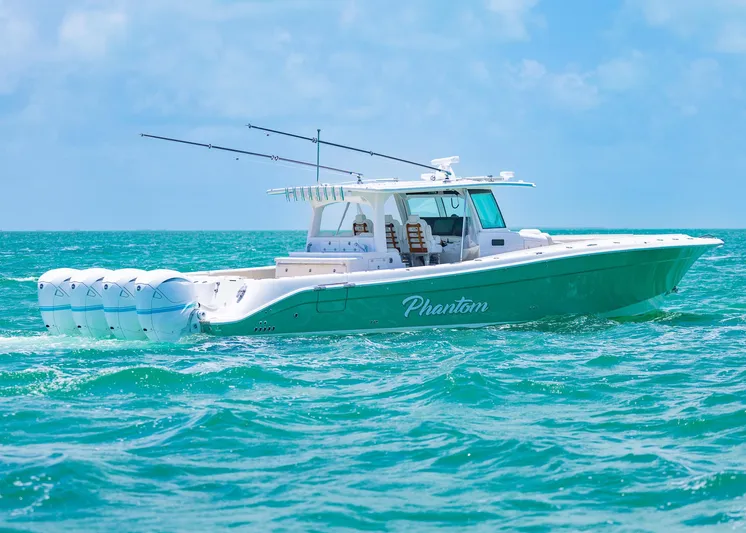  Yacht Photos Pics 2021 HCB 53 Sueños boat cruising on turquoise ocean waters.