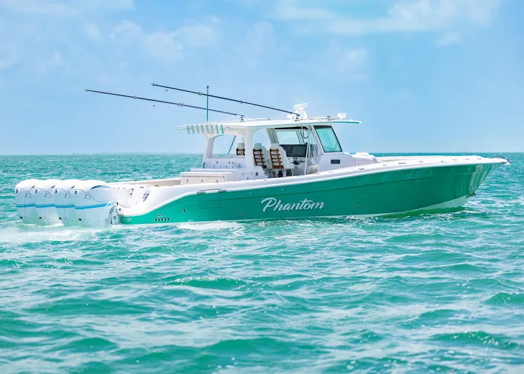  Yacht Photos Pics 2021 HCB 53 Sueños boat cruising on turquoise waters under a clear sky.