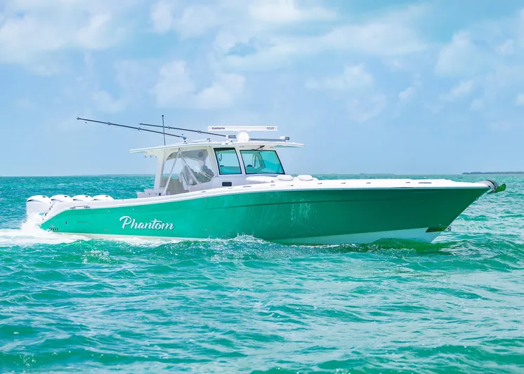  Yacht Photos Pics 2021 HCB 53 Sueños boat cruising on turquoise ocean waters.