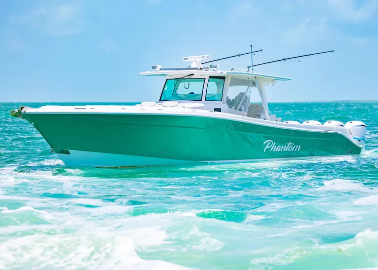  Yacht Photos Pics 2021 HCB 53 Sueños boat cruising on turquoise ocean waters.