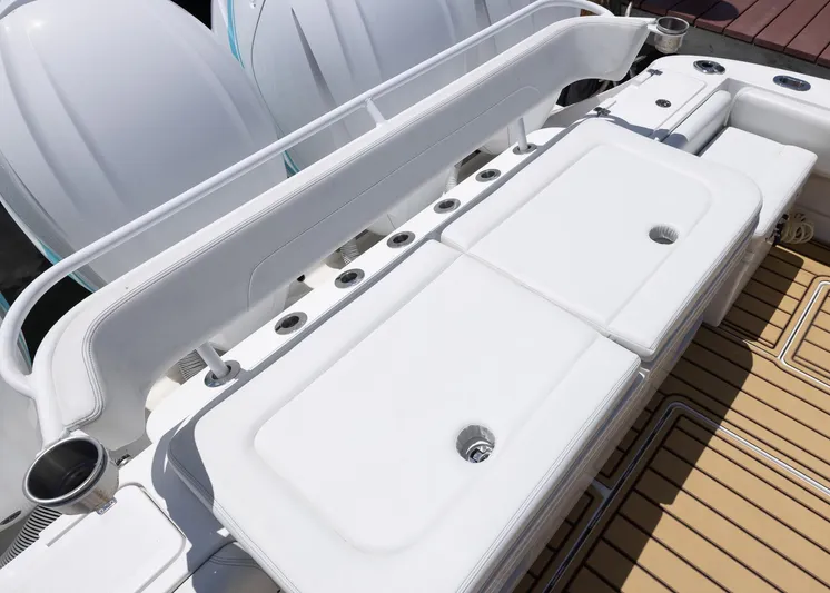  Yacht Photos Pics 2021 HCB 53 Sueños boat deck with white seating and cup holders.