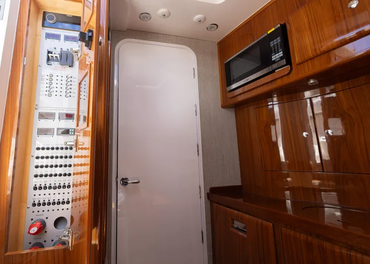  Yacht Photos Pics Interior of 2021 HCB 53 Sueños yacht with control panel and microwave.