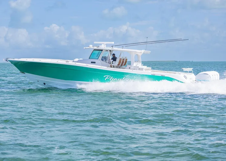  Yacht Photos Pics 2021 HCB 53 Sueños boat cruising on open water under a clear sky.