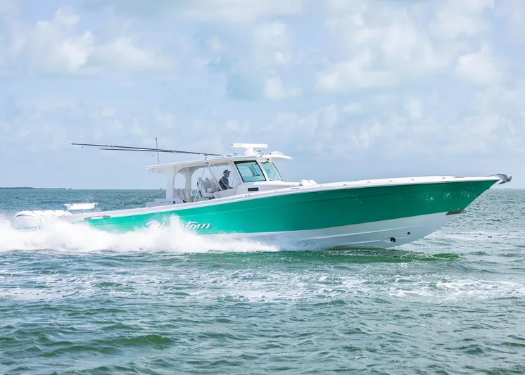  Yacht Photos Pics HCB 53 Sueños 2021 boat cruising on open water under a clear sky.
