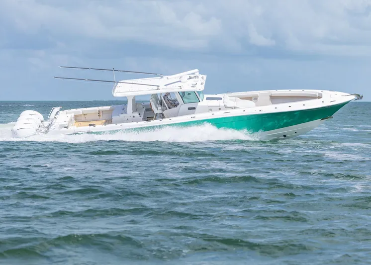  Yacht Photos Pics 2021 HCB 53 Sueños boat cruising on open water, featuring sleek design and powerful engines.