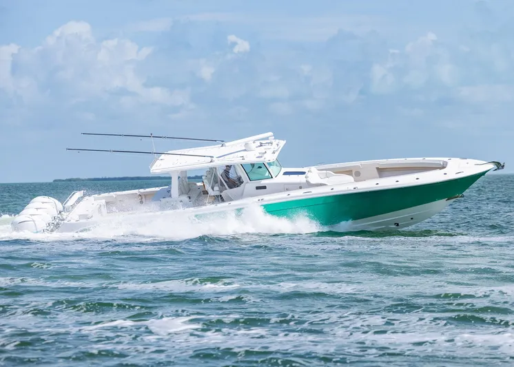  Yacht Photos Pics 2021 HCB 53 Sueños boat cruising on open water under a clear sky.