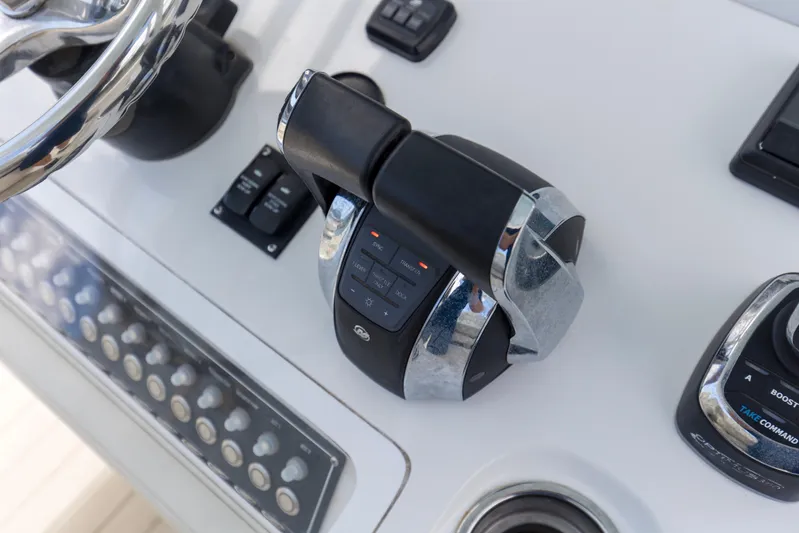  Yacht Photos Pics Control panel of 2020 Invincible 39 Open Fisherman boat with steering wheel and throttle.