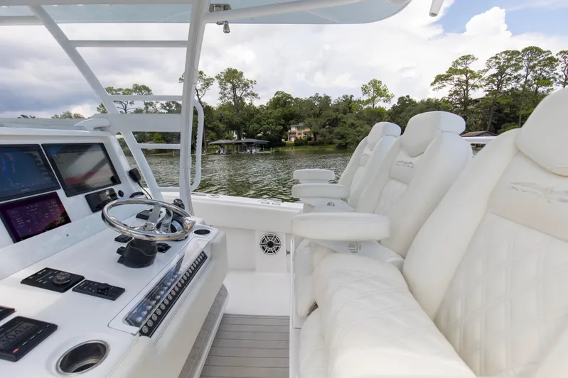  Yacht Photos Pics Interior of 2020 Invincible 39 Open Fisherman boat with luxurious seating and control panel.