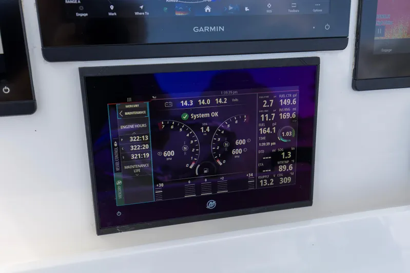  Yacht Photos Pics 2020 Invincible 39 Open Fisherman dashboard with Mercury engine display and Garmin navigation.