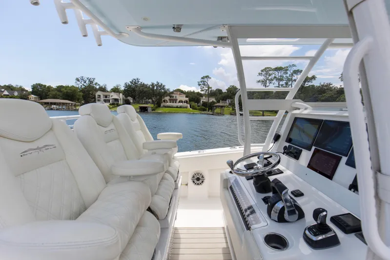  Yacht Photos Pics 2020 Invincible 39 Open Fisherman boat interior with luxurious seating and advanced navigation controls.