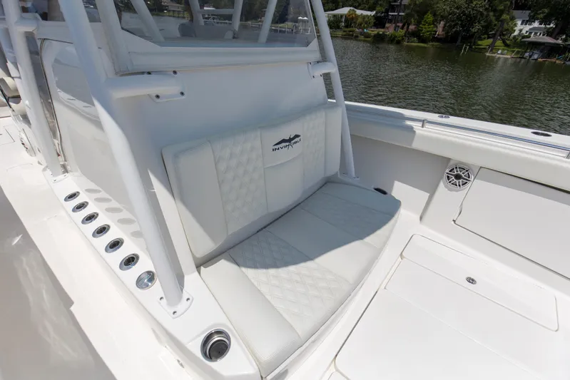  Yacht Photos Pics 2020 Invincible 39 Open Fisherman boat interior with cushioned seating and rod holders.